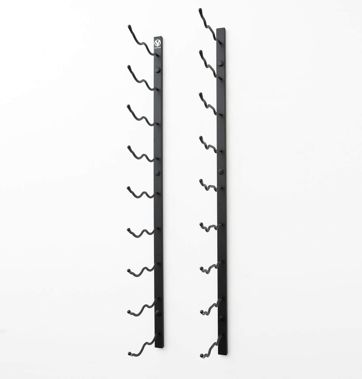 Wall-mounted wine rack with dark metal frame and curved bottle hooks