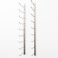 Wall-mounted silver wine rack frame with curved bottle-holder pegs
