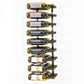 Wall-mounted black wine rack holding wine bottles with red corks