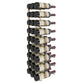 Wall-mounted black wine rack holding wine bottles in multiple rows