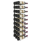 Wall-mounted black wine rack holding wine bottles in a stacked layout