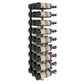 Wall-mounted black wine rack holding multiple wine bottles with corks facing outward.