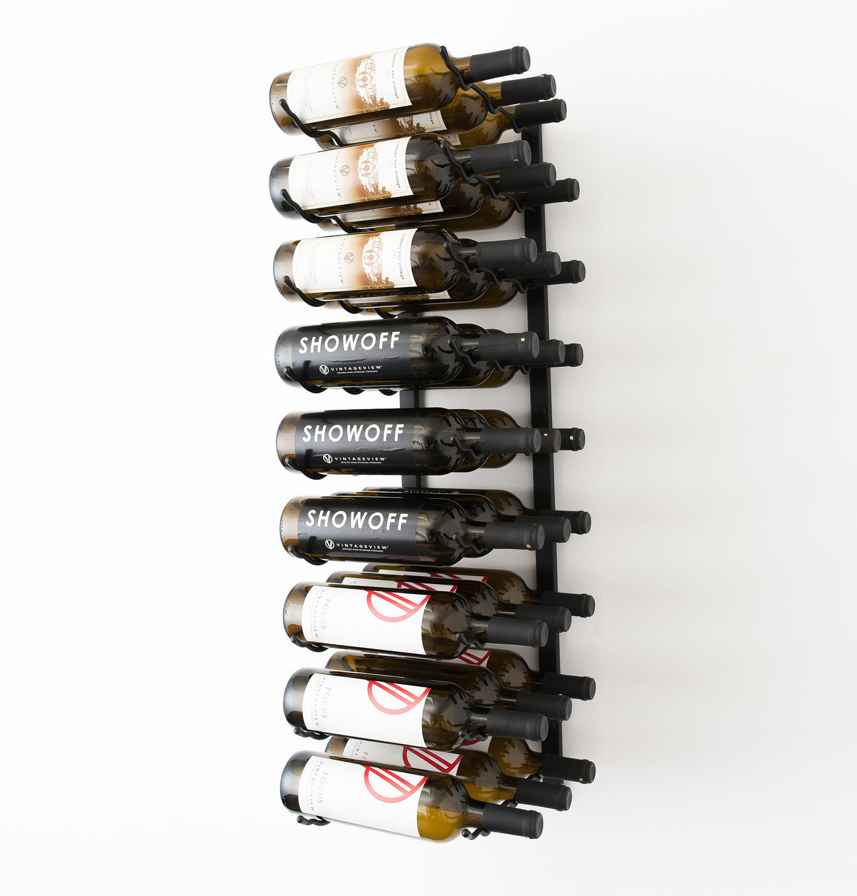 Wall-mounted black wine rack holding wine bottles with some labels visible.