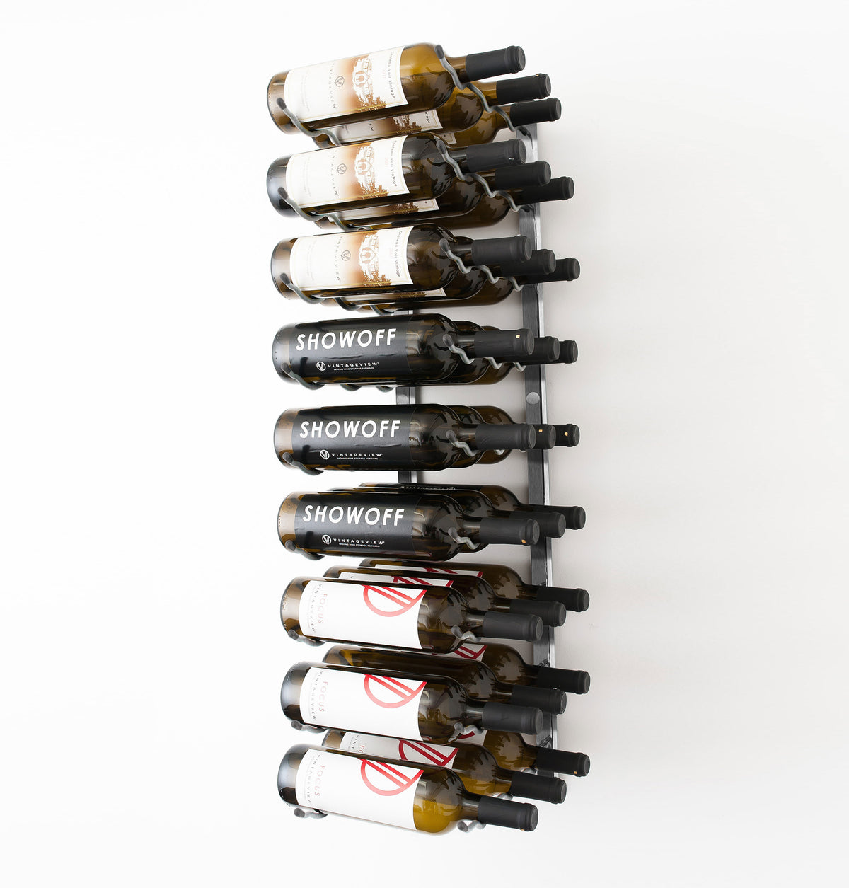 Wall-mounted black wine rack holding wine bottles with necks supported by round pegs.