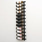 Wall wine rack displaying bottles on curved black hooks along the rails