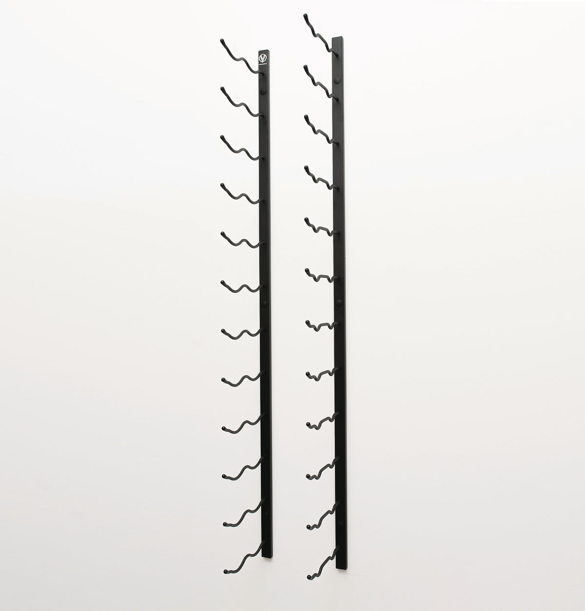 Wall-mounted wine rack with two black metal frames and curved bottle hooks