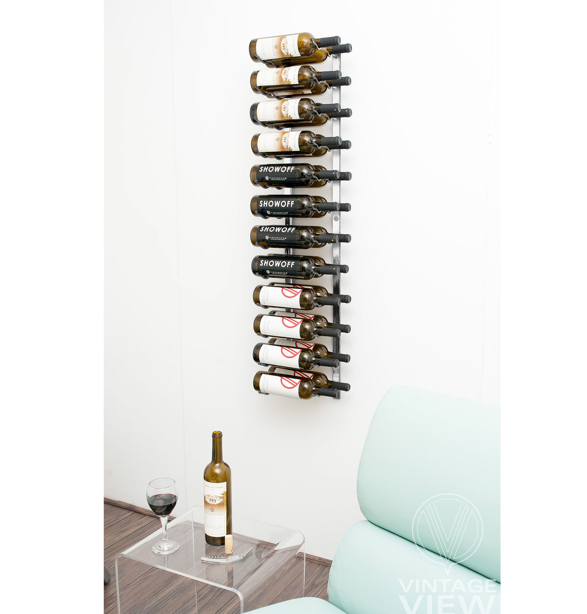 Wall-mounted wine rack with black bottle holders holding wine bottles