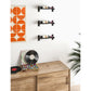 Wall-mounted wine bottle rack with black rails and horizontal bottle slots