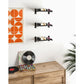 Wall-mounted wine bottle racks with three 1-column compartments holding bottles