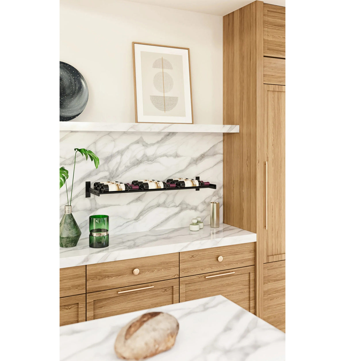 Installed wall wine bottle rack with three rows of bottles on white stone shelf