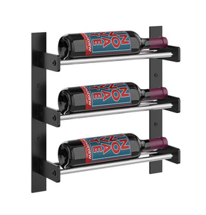 Black wall wine rack with three wine bottles on light wood-toned shelves