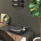 Compact wall wine bottle rack with three bottles next to a record player and turntable