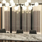 Wine wall display with multiple two-column racks and rows of wine bottles