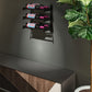 Three-bottle black wine rack wall mount with empty mounting arms visible