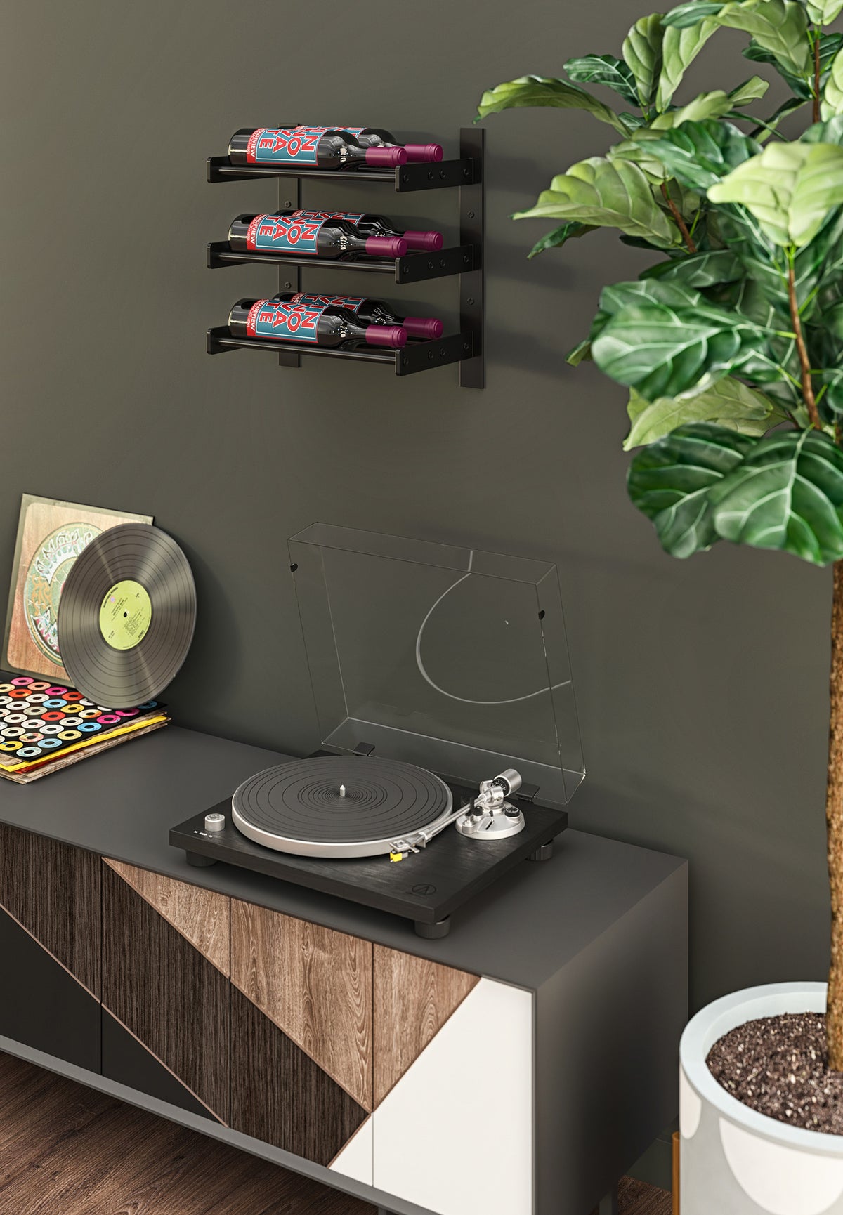 Black wall wine bottle holder rack with three bottles and slanted support brackets