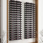 Wine bottle rack with black rails inside open wooden door cabinet, rows of bottles
