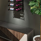Wall-mounted wine bottle rack with black metal frame holding three bottles