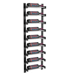 Black wine wall rack with silver rails, holding red wine bottles in slots