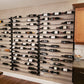 45-inch wine bottle wall rack in a kitchen, holding bottles on horizontal rails