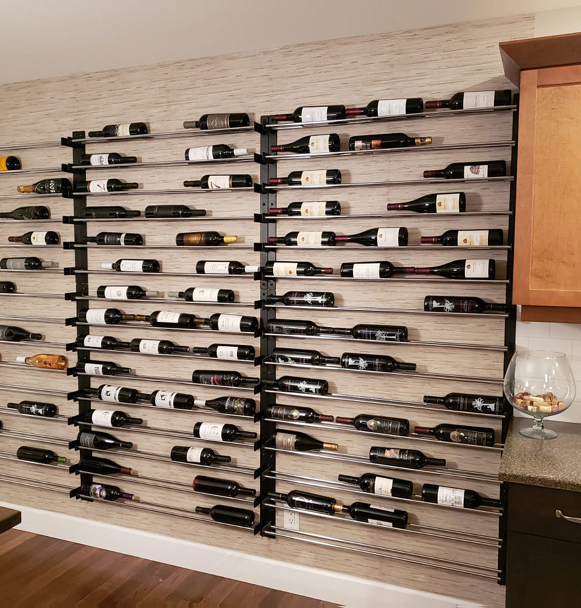 45-inch wine bottle wall rack in a kitchen, holding bottles on horizontal rails