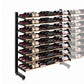 Single-sided wine rack with black metal frame and bottle storage rows, angled view