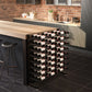 Matte black wine bottle island rack with double-sided, multi-tier storage for bottles