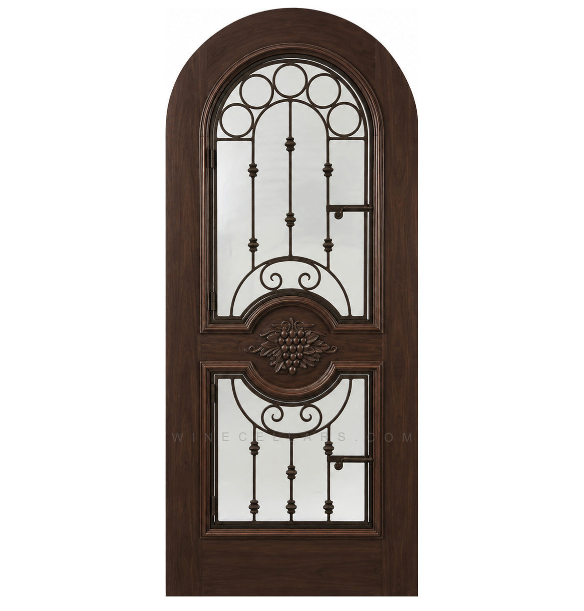 Medium-brown wood wine cellar door with arched iron speakeasy grille and decorative inset panels
