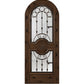 Dark brown wood wine cellar door with arched iron speakeasy grille and decorative inset panels
