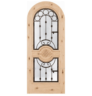 Natural light wood wine cellar door with arched iron speakeasy grille and decorative inset panels