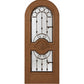 Natural wood tone arched wine cellar door with decorative iron grille and two glass panels