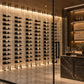 Tall cable wine rack wall with hanging bottles and golden bronze mounting posts
