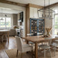 Pair of side-by-side wine refrigerators with glass doors and bottle-filled wooden racks