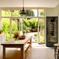 Goguette wine shelf insert visible in a wine cooler beside a kitchen table
