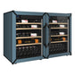 Pair of slate blue wine refrigerators with glass doors and bottles on wooden shelves