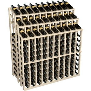 Light wood wine bottle display rack with bottle slots; black bottles with label fronts