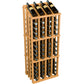 Wine bottle display rack with dark bottles in a light orange wood frame and metal holders.