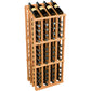 Wine bottle display rack with dark bottles in a light wood frame and circular metal holders.
