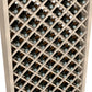 Close-up of wood wine bottle cabinet with diamond lattice and bottle necks