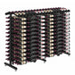 Double-sided wine bottle display rack with black frame and neatly aligned wine bottles.