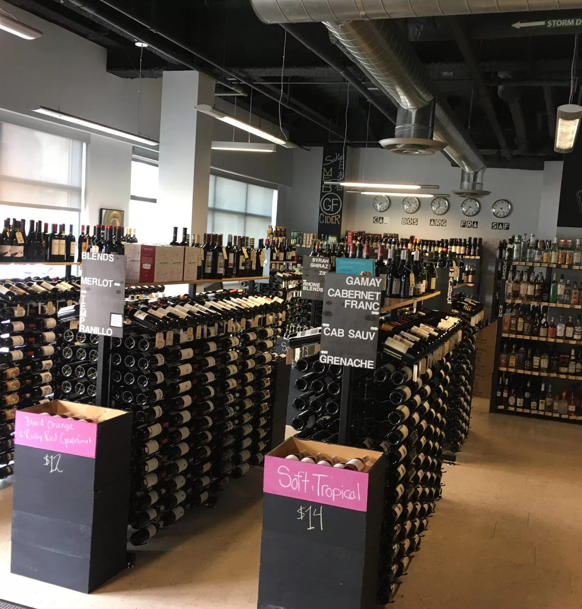 Wine rack extension in a retail setting, with long rows of wine bottles