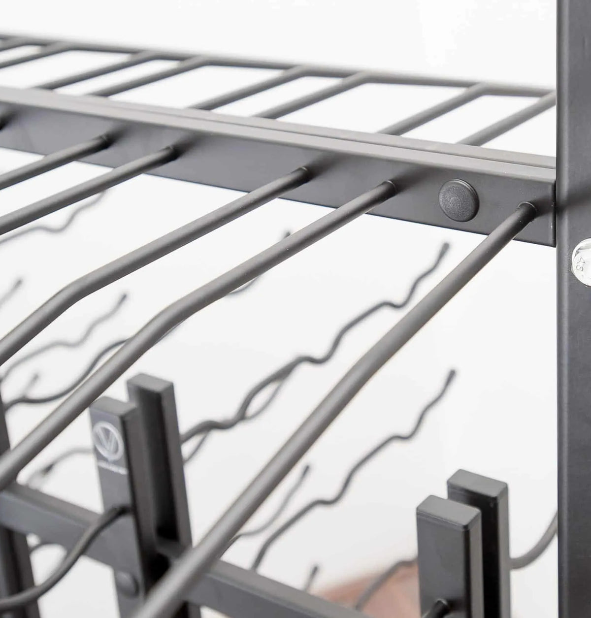 Metal wine rack extension detail with parallel bars and mounting brackets
