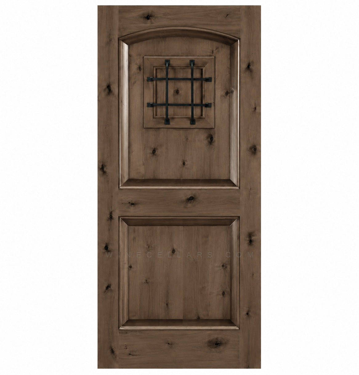 Pale brown wood wine cellar door with arched top, iron speakeasy grille, and recessed panels