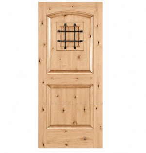 Light pine-style wine cellar door with arched top, iron speakeasy grille, and recessed panels