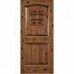 Medium brown wood wine cellar door with arched top, iron speakeasy grille, and recessed panels
