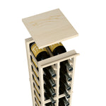 Natural wood wine rack top shelf on open frame, upright wine bottles visible.