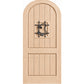 Arched-top wooden wine cellar door in light wood with centered wrought-iron speakeasy grate