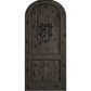 Arched-top black stained wooden wine cellar door with centered wrought-iron speakeasy grate