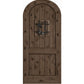 Arched-top gray-brown wooden wine cellar door with centered wrought-iron speakeasy grate