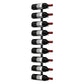 Wall wine rack holding multiple wine bottles with red bottle caps