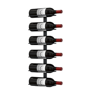 Wall wine rack with several wine bottles displayed vertically, red caps visible